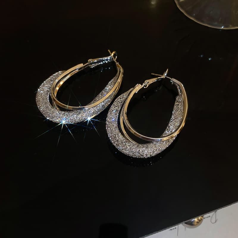 Silver Two-Tone Twisted Oval Hoop Earring — front view