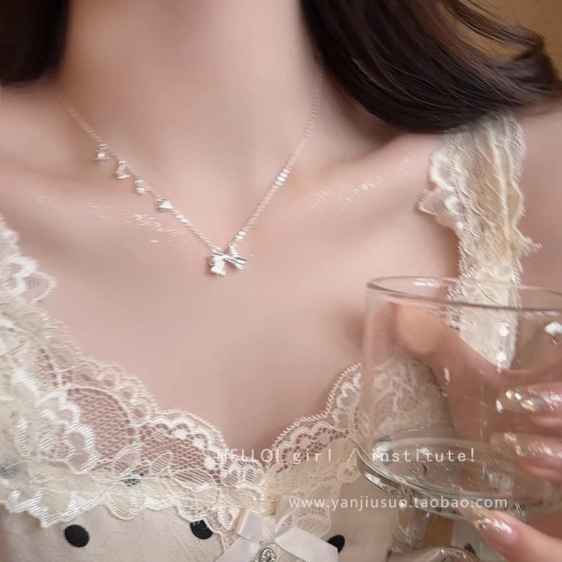 Silver Heart Bow Pendant Necklace — front view