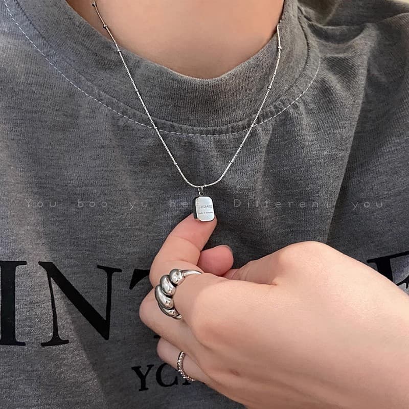 Silver Letter Tag Pendant Necklace — front view