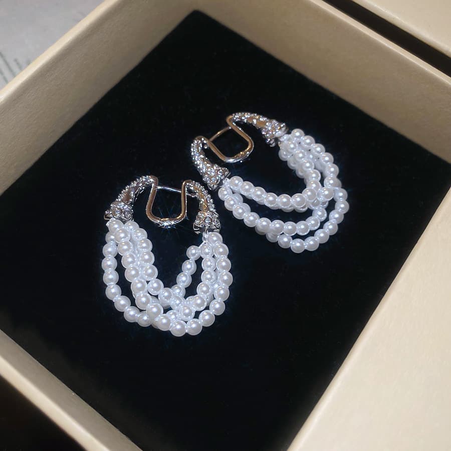 Silver Triple-Strand Crystal Pearl Clip-on Earring — front view
