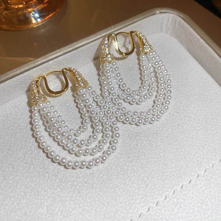Gold Multi-Strand Cascade Pearl Clip-on Earring — front view