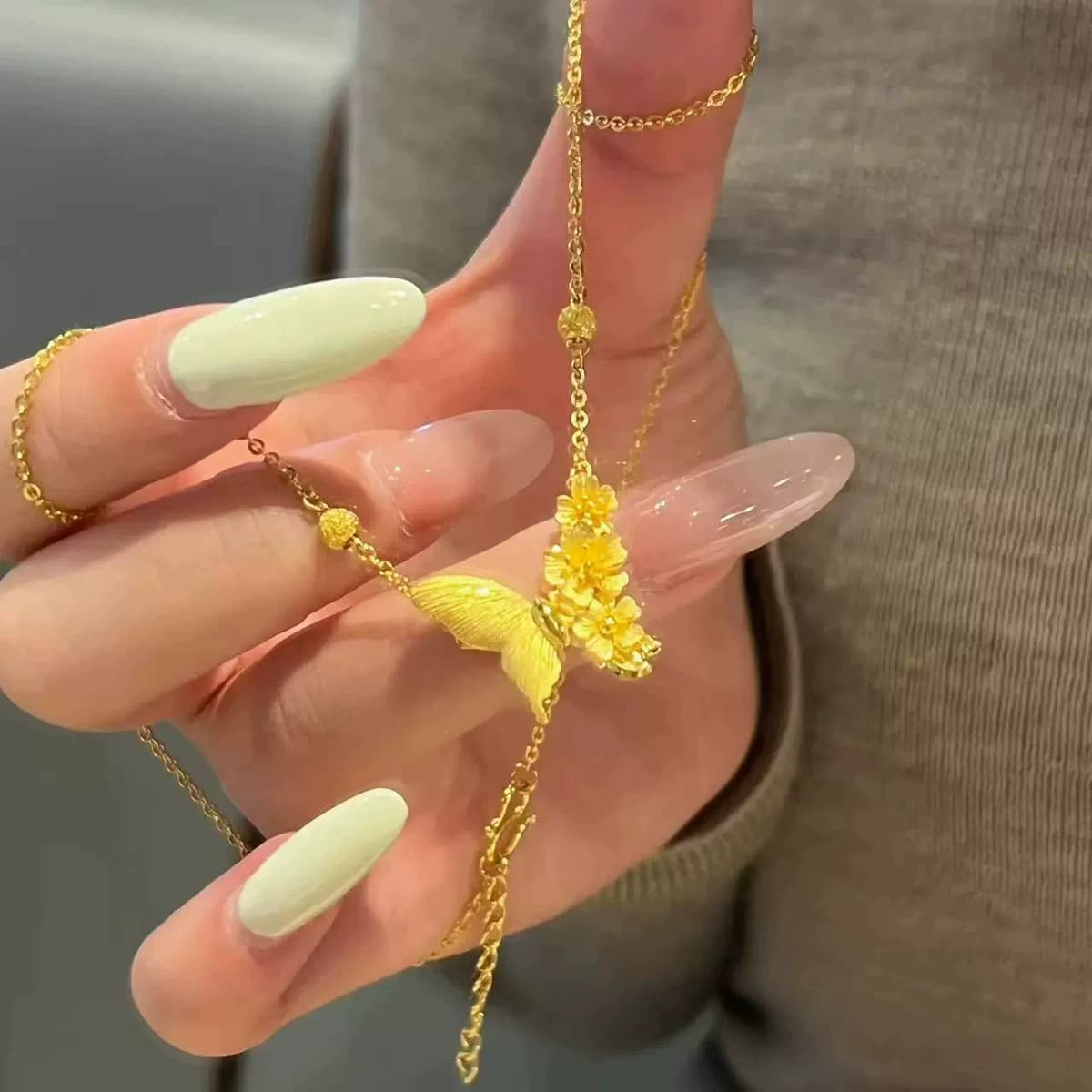 Gold Butterfly Flower Cluster Pendant Necklace — front view