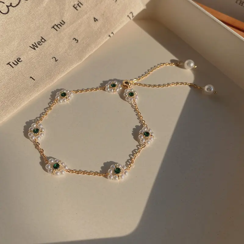 Gold Pearl Daisy Flower Charm Bracelet — front view