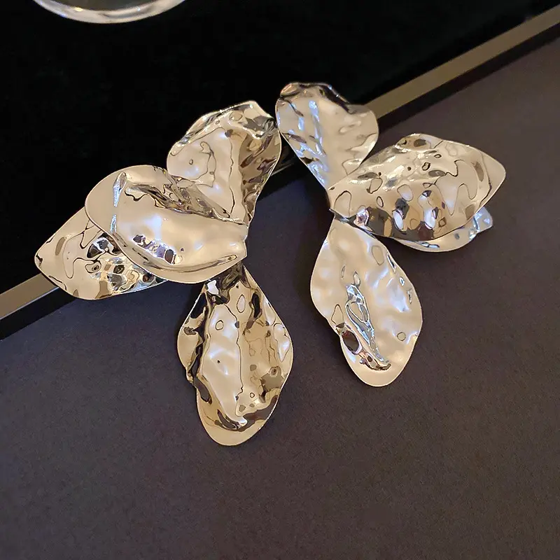 Silver Hammered Bow Petal Stud Earring — front view