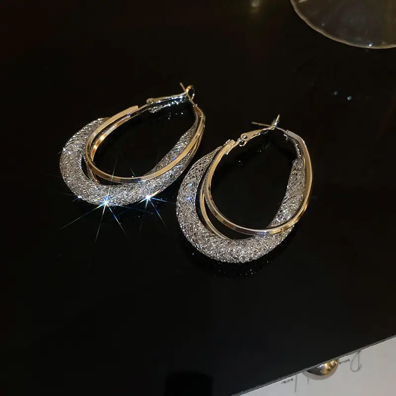 Silver Two-Tone Twisted Oval Hoop Earring — front view