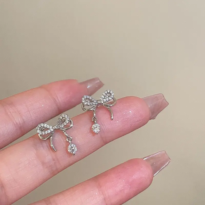 Silver Crystal Bow Drop Stud Earring — front view