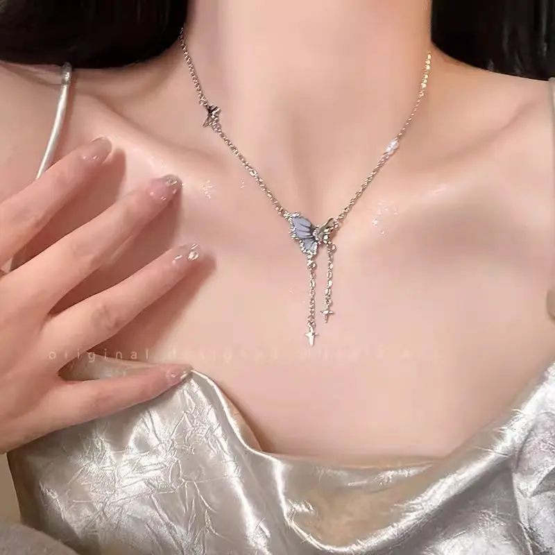 Silver Starburst Butterfly Tassel Necklace — front view