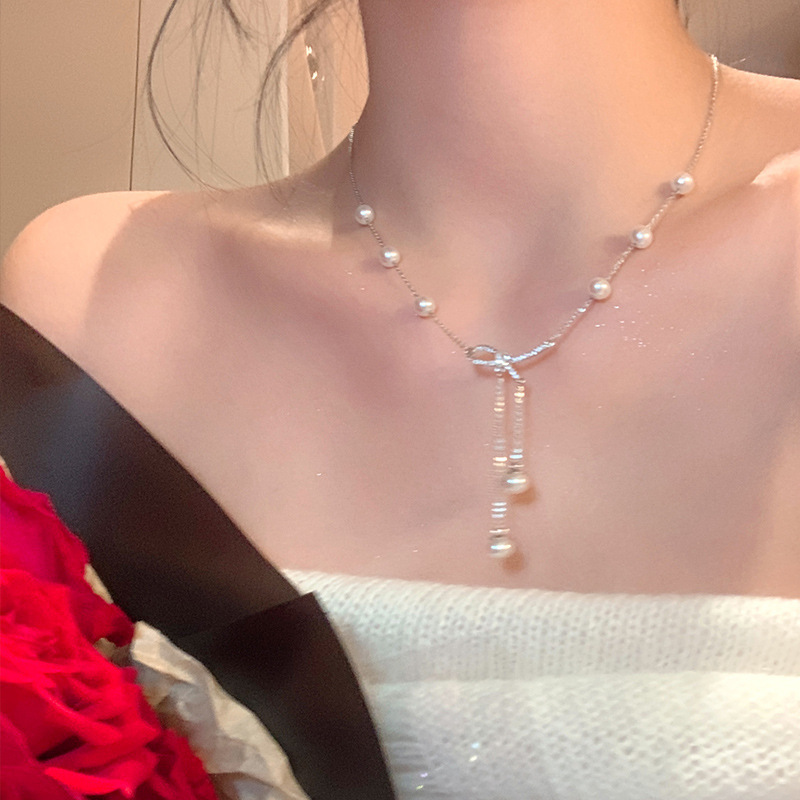 Silver Pearl Station Bow Lariat Necklace