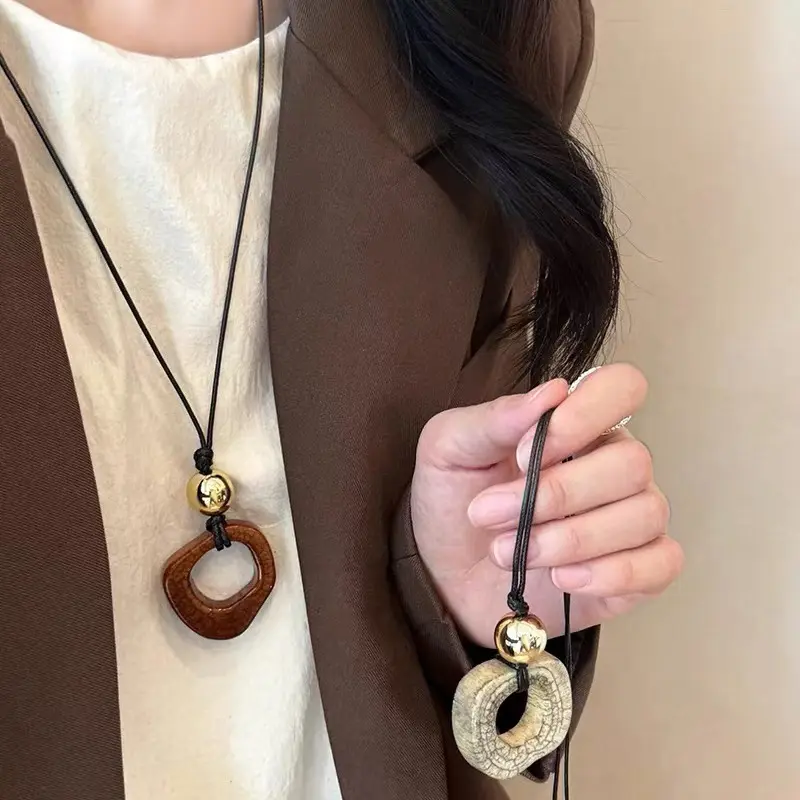 White Imitation Bone Ring Cord Long Necklace — front view