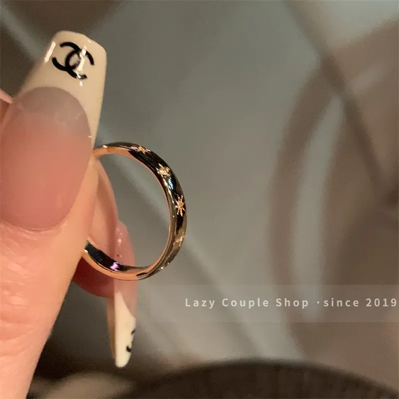 Gold Starburst Engraved Thin Band Ring — front view