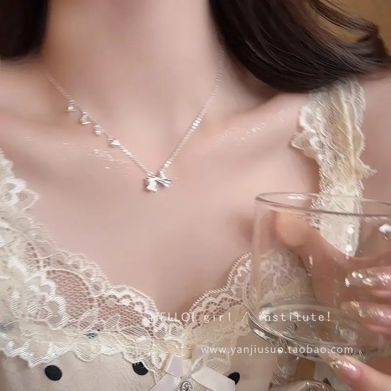 Silver Heart Bow Pendant Necklace — front view