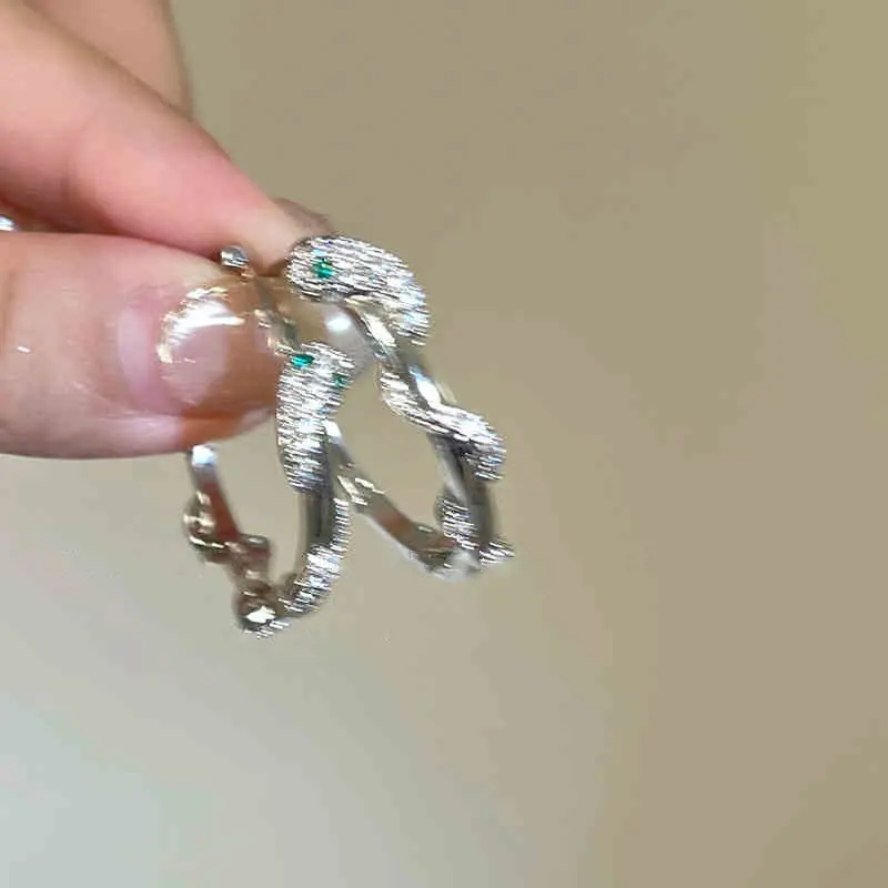 Silver Twisted Branch Green Crystal Clip-on Earring — front view