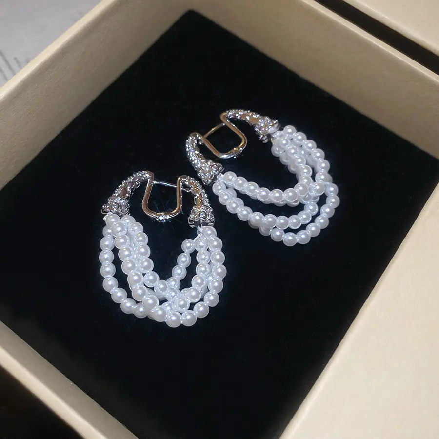 Silver Triple-Strand Crystal Pearl Clip-on Earring — front view
